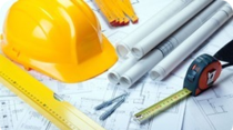 Hard hat, blueprints and tools