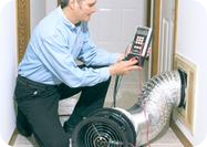 Technician running a duct leakage test