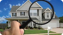 House under a magnifying glass for a home energy audit