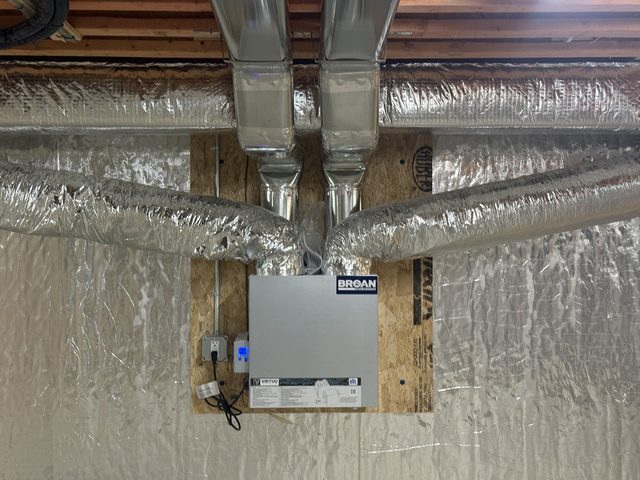 Broan energy recovery ventilator (ERV) installed with insulated ducts in a basement