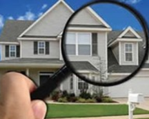 House under a magnifying glass for a home energy audit